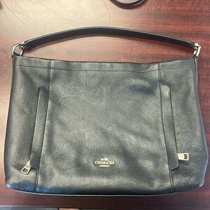 Black leather coach purse with silver accents
